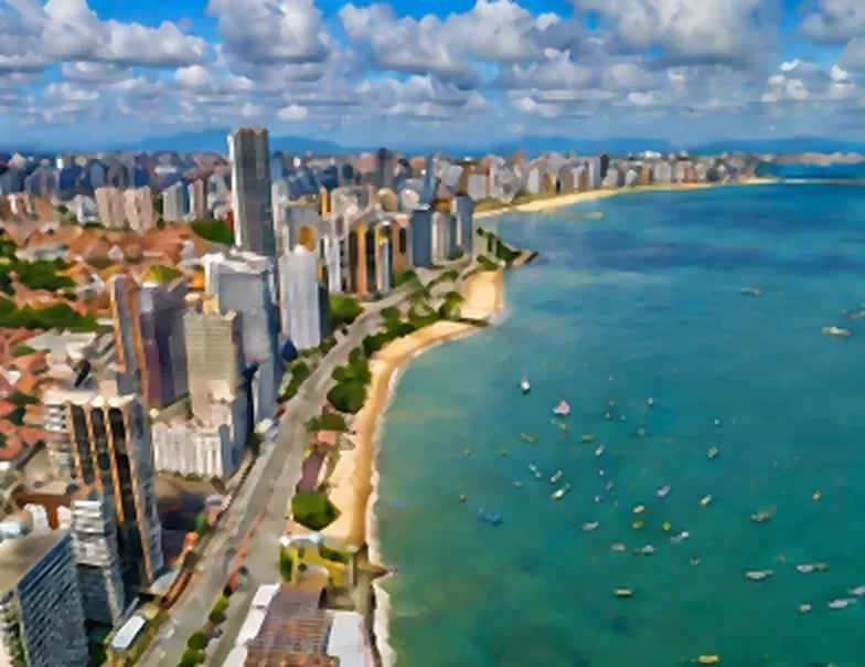 Vista aérea da orla de Fortaleza, com prédios e mar